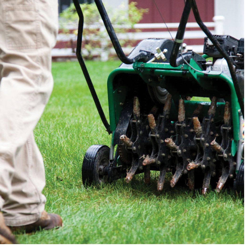 Aeration machine with hollow tines working through a residential lawn